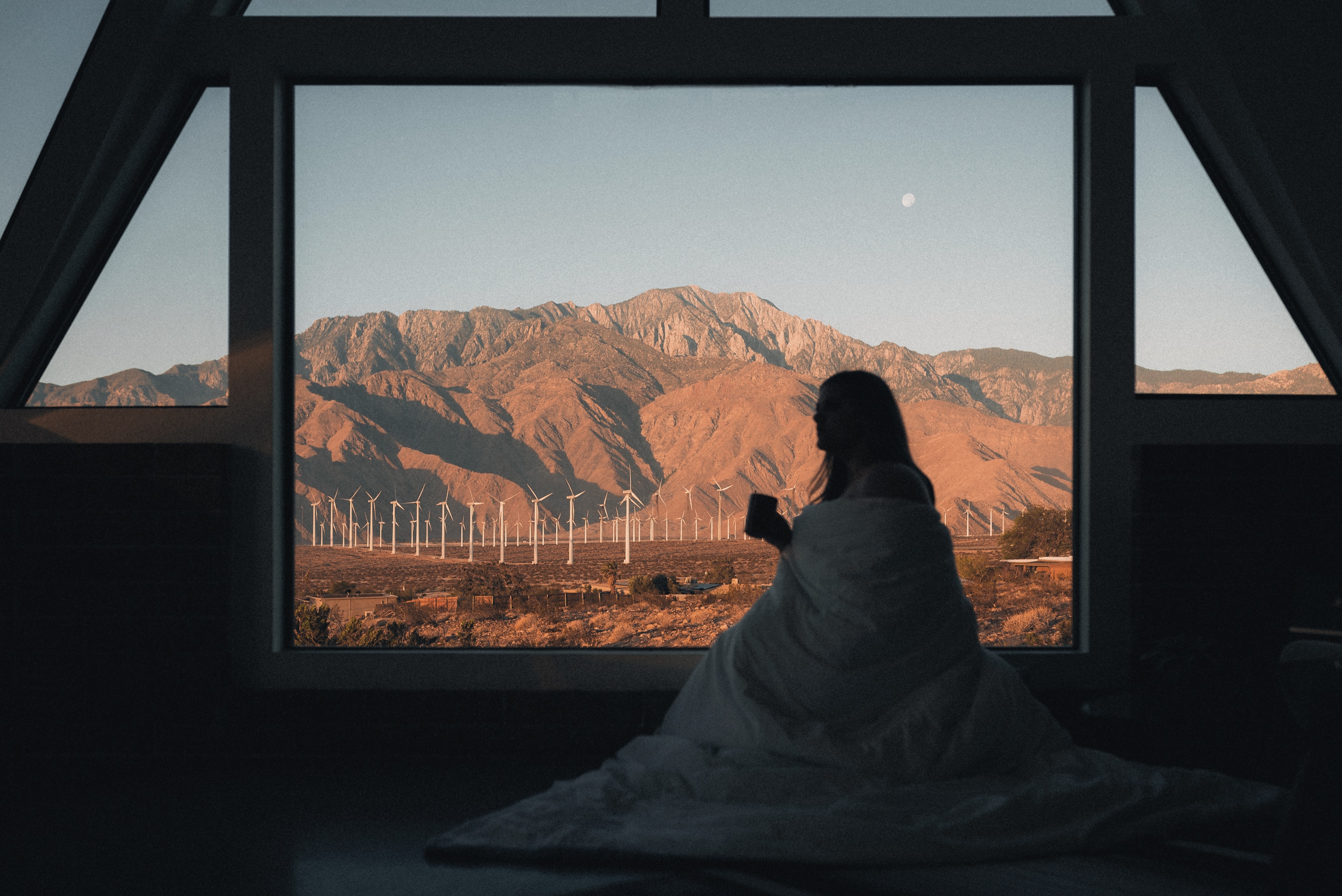 An Airbnb overlooking a wind farm in the desert.
